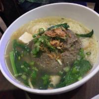 Bakso Beranak / Pregnant Meat Ball · Big meat ball filled with small meat balls and quail eggs in soup, served with egg noodle, v...