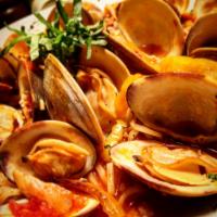 Clam Zuppa · Native littlenecks, Italian sausage, onions, garlic, fresh basil, spicy-tomato clam broth, c...