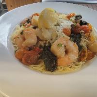 Shrimp and Scallop Scampi · Roasted grape tomato, spinach, garlic wine sauce, angel hair pasta.