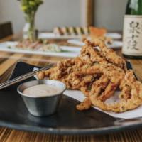 Ika Fries · Fried strips of calamari tenderloin served with tsurai sauce.