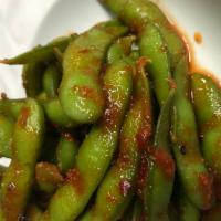 Spicy Edamame · Boiled soybeans tossed with our sambal sweet chili sauce.