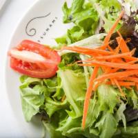 Mixed Green Salad · Baby greens with carrots, tomatoes, and sesame soy dressing. Eat Fit.