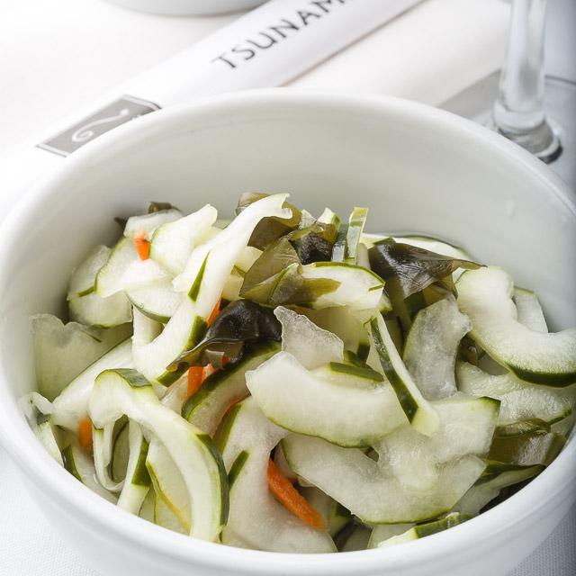 Sunomono Salad · Sour and sweet Japanese salad of marinated cucumber, wakame, and carrots.