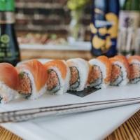 Rainbow Roll · Snow crab mix, avocado, topped with tuna, escolar, and salmon. Raw.