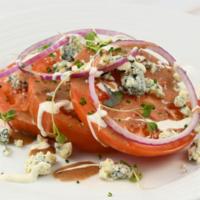 Beefsteak Tomato Salad · Red Onions, Roquefort Cheese, Cilantro Ranch, & Balsamic Vinaigrette