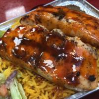 Honey Sriracha Seared Glazed Salmon Over Rice · Comes with lettuce tomatoes onions and cucumbers.