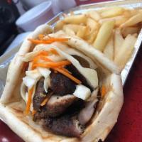 Jerk Chicken Gyro Combo · Served with french fries and drinks.
