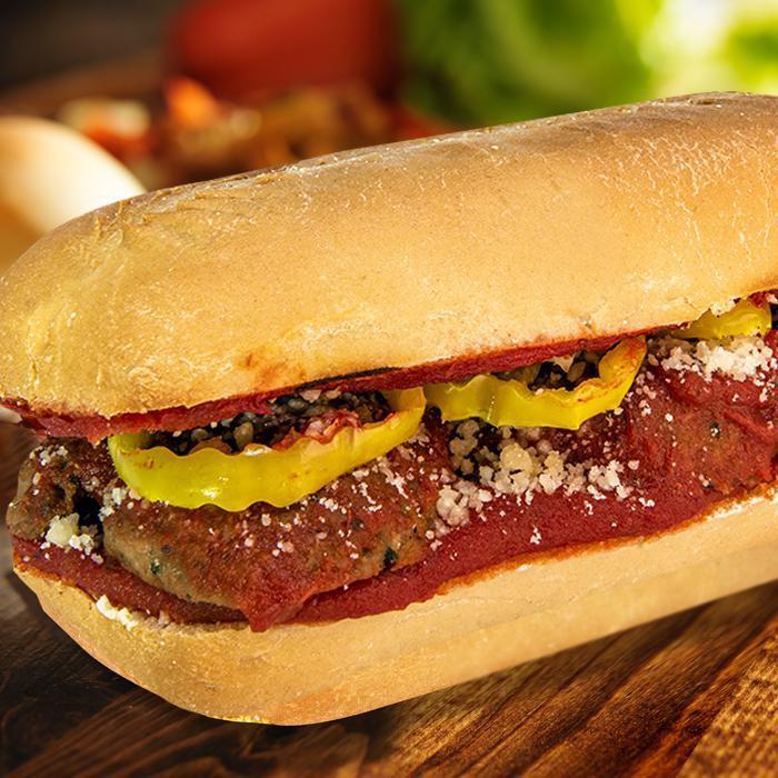 Soaked Meatball Marinara · Premium sliced Italian meatballs slow cooked in marinara sauce with banana peppers and grated Parmesan cheese on a baked Italian sub roll.