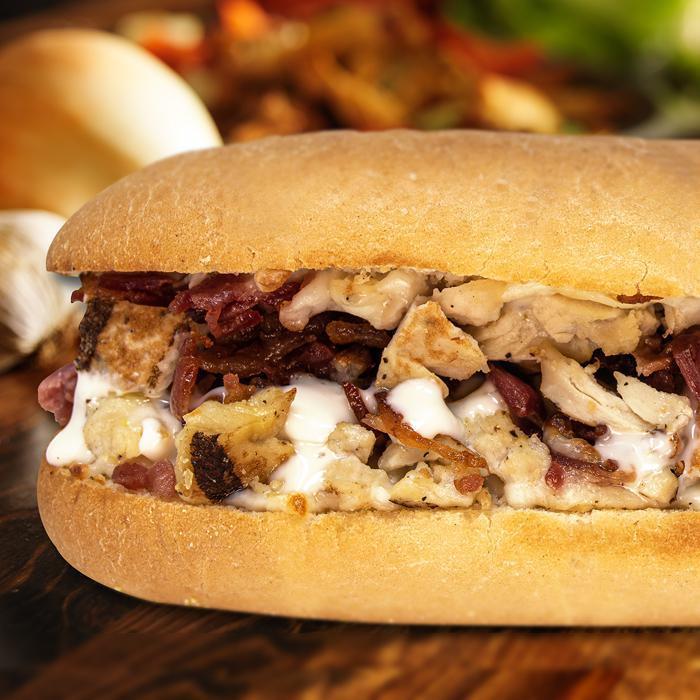 Rooster's CBR Sandwich · Chunks of grilled chicken breast with crispy diced bacon, mozzarella cheese and Marzetti ranch dressing on a baked Italian sub roll.