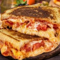 Outrageous Grilled Cheese · Mozzarella, Muenster, cheddar, Parmesan and provolone cheese with sliced tomato and marinara...
