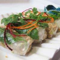BASIL CHICKEN WRAPPED (5) · Minced chicken, basil leaves, carrots, onions & lettuce wrapped in steamed rice paper. (No a...