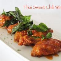 CHICKEN WINGS · Fried chicken wings served with Thai street sweet chili sauce & topped with fried sweet basil.