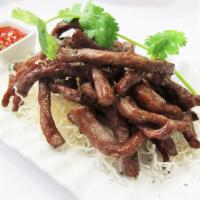 THAI BEEF JERKY (8 oz) · Fried marinated beef strips served with spicy sriracha sauce