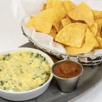 Warm Village Dip · Blended cheeses, bacon & scallions, served with tortilla chips & fresh salsa