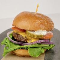 Cheddar Burger · Cheddar cheese, lettuce, tomato, red onions, dill pickles & champagne mustard
