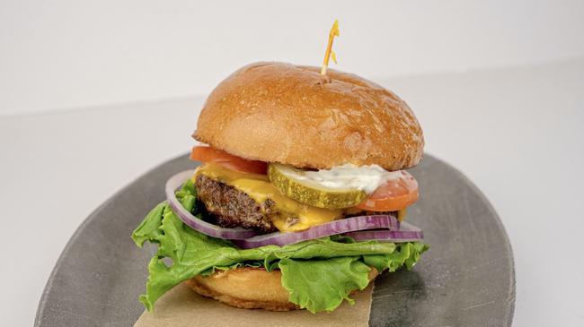 Cheddar Burger · Cheddar cheese, lettuce, tomato, red onions, dill pickles & champagne mustard