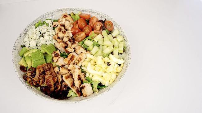 Village Cobb Salad · Fresh romaine, grilled chicken, cucumbers, grape tomatoes, chopped egg, bacon, avocado & crumbled blue cheese with house vinaigrette
