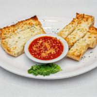 Garlic Cheese Bread · Garlic Cheese Bread Served with Red Sauce on the side for dipping.