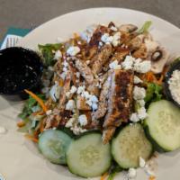 Cajun Chicken Salad · Served on a bed of greens with tomatoes, black olives, shredded carrots, cucumbers and crout...
