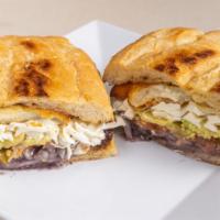 Milanesa de Res Torta · Breaded Beef Traditional Mexican sandwich, served on a telera toasted bread, coated with ref...