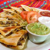 10. Quesadilla Plate · Served with guacamole, salsa, and sour cream. Served with beans and rice or french fries.