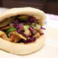 Build Your Own Pita · Choice of protein, hummus, pickles, Jerusalem salad, seasoned onions, and red cabbage served...
