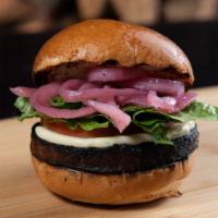 The Meatless · Beyond Burger vegetarian patty of wild rice, walnuts, black beans, roasted onion, confit gar...
