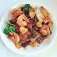 Happy Family · A combination of BBQ pork, chicken, beef, shrimp and scallops stir-fried with fresh vegetabl...