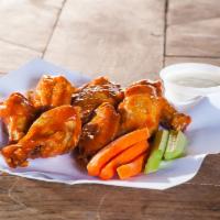 Traditional Bone In Buffalo Chicken Wings  · 8 thick, juicy chicken wings (drums and wings), deep fried, coated with your choice of one o...
