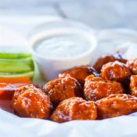 Boneless Chicken WIngs · Thick, juicy chicken portions, deep fried, and coated with your choice of one of our homemad...