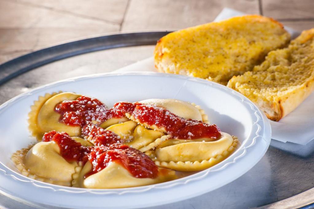 Ravioli · Cheese ravioli, served with your choice of sauce and a side of garlic bread.  Consider customizing your pasta with meatballs, sausage, eggplant or chicken for an additional charge.