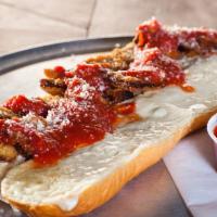 Eggplant Parmigiana Hero · Our fresh Italian hero roll stuffed with breaded eggplant, blanketed with mozzarella cheese,...