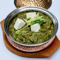 Veggie Saag Paneer · Cube of homemade cheese with spinach and green herbs. Vegetarian.