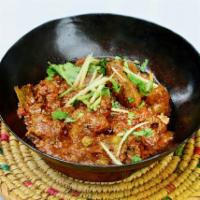 Bone-In Ginger Lamb Karahi · Small pieces of bone-in lamb with house spices tomatoes, garlic, and ginger. Cooked on tradi...