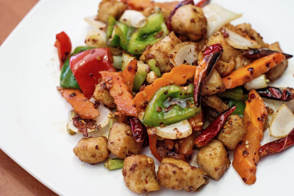 Chong Xing Chili Chicken · Diced chicken stir fry with bell pepper, carrot and onion in a fiery spicy sauce.