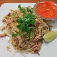 Pork Pad Thai · Wok-tossed Thai rice noodles with BBQ pork, egg, bean sprout, scallions and onion, fish sauc...