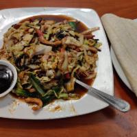 Moo Shu Pork · Pork, cabbage, tree mushroom, onion, egg and 4 pieces Chinese pancakes.