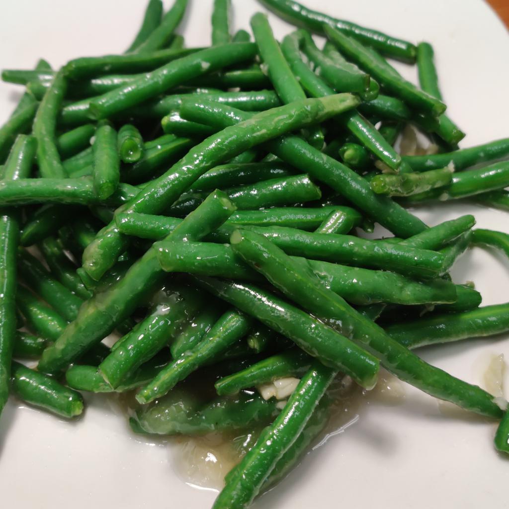 Green Bean in Garlic Sauce · Stir-fried green bean with onion and garlic.