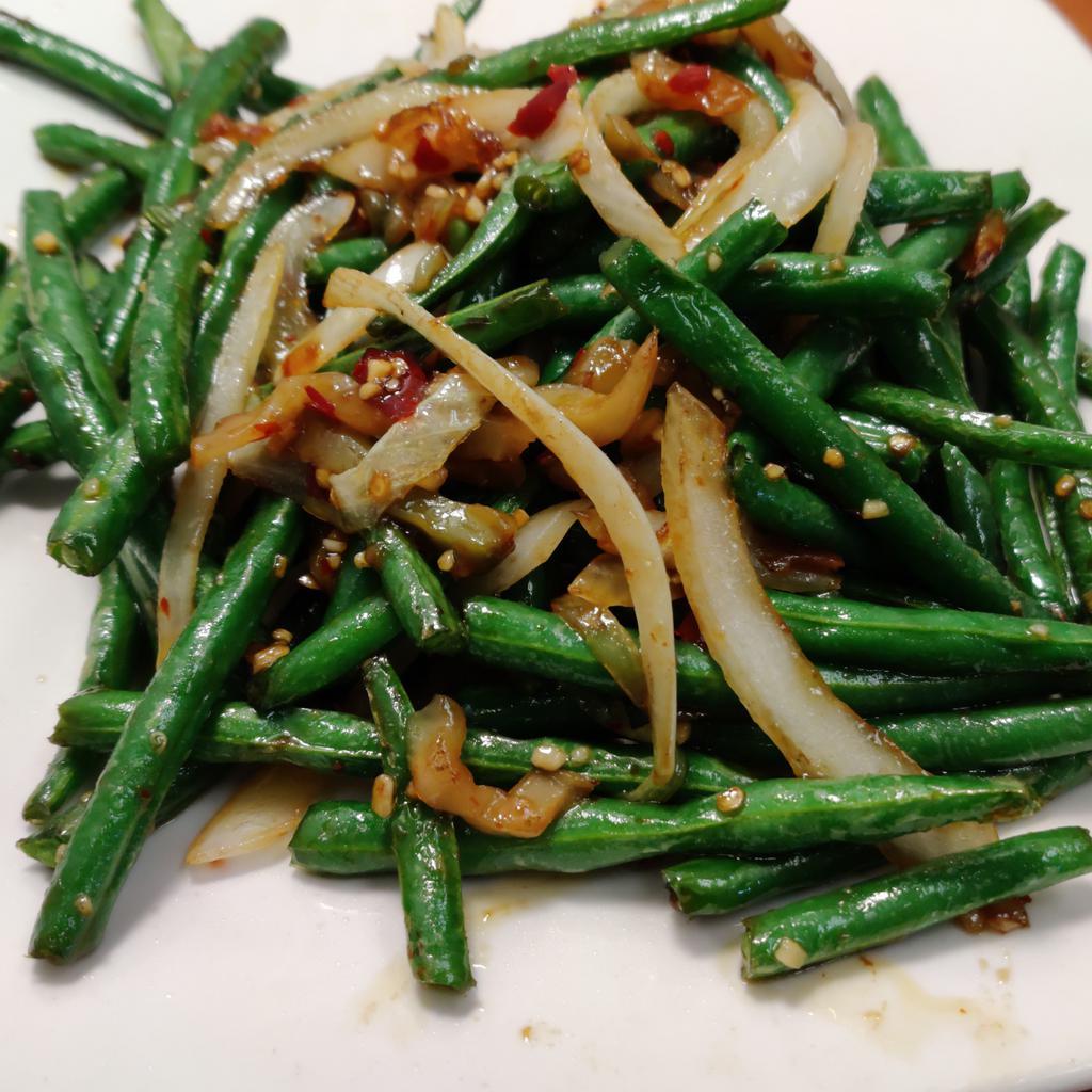 Szechwan Green Bean · Green bean tossed with ginger, garlic, onion and preserved vegetable in a spicy Szechwan sauce.