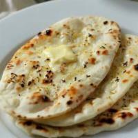 Butter Naan  · Traditional Indian bread baked in clay oven with a hint of fresh butter.