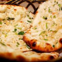 Garlic Basil Naan · Flat bread topped with garlic and basil - chef's recommendation.