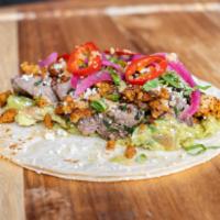 Taco Bamba · Skirt steak, chorizo, guacamole, cotija cheese, pickled onion, pickled chile, cilantro, chic...