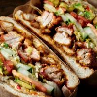 Big Red Torta · Spiced crispy chicken, pickled chiles, chihuahua cheese, rooster sauce, lettuce, tomato, avo...