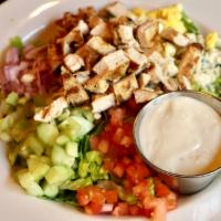 Classic Cobb Salad · Romaine lettuce with grilled chicken, crisp smoked bacon, hard-boiled egg, tomatoes, cucumbe...