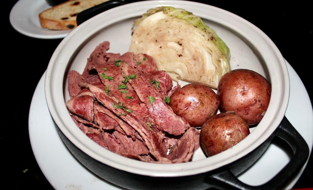 Corned Beef and Cabbage · Sliced corned beef with cabbage and red bliss potatoes. Irish soda bread.