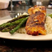 Salmon Milanese · Salmon is served over risotto rice and sauteed asparagus (available with blackened salmon).