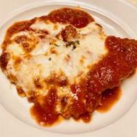 Veal Parmigiana · A tender veal cutlet baked in a marinara sauce and mozzarella cheese.