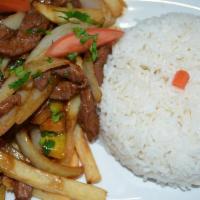 08. Lomo Saltado con Arroz · Sauteed beef with onions, tomatoes and french fries served with rice.