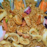 23. Arroz Chaufa de Mariscos · Seafood fried rice Peruvian style.