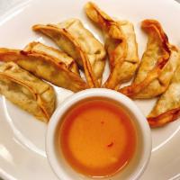 Pot Sticker (6) · Pan-fried pot stickers with Chicken, cabbage, onion served with soy-ginger dipping sauce.